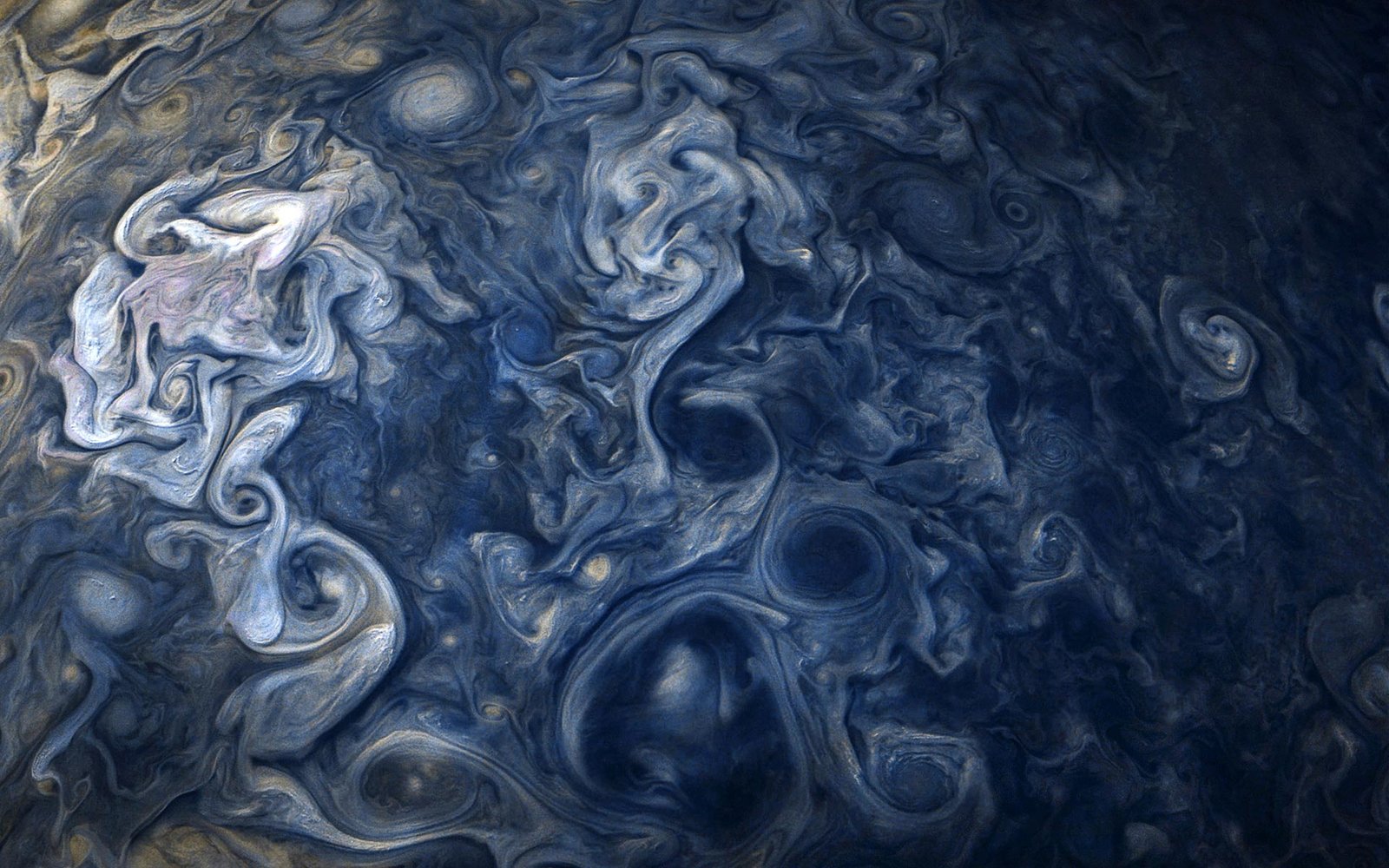 Jupiter’s Colossal Cyclones Driven by Earth-Like Atmospheric Processes